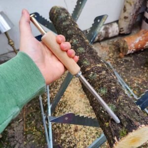 A tool for planting mycelium on sawdust into logs