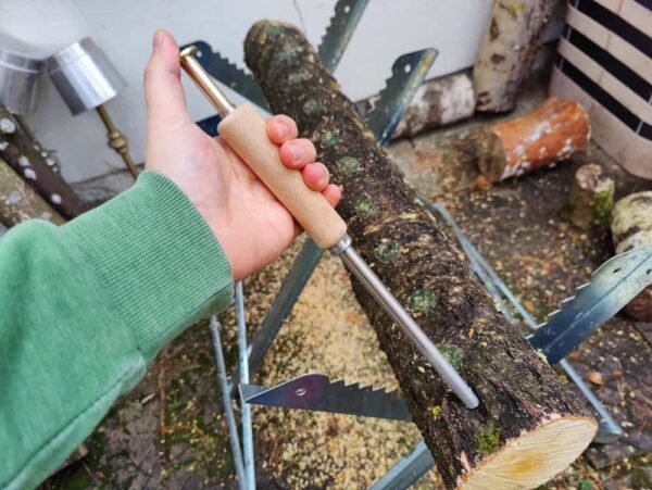 A tool for planting mycelium on sawdust into logs